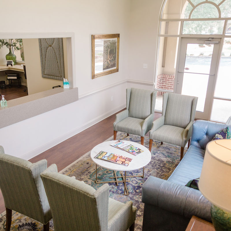 chairs and blue couch in waiting room